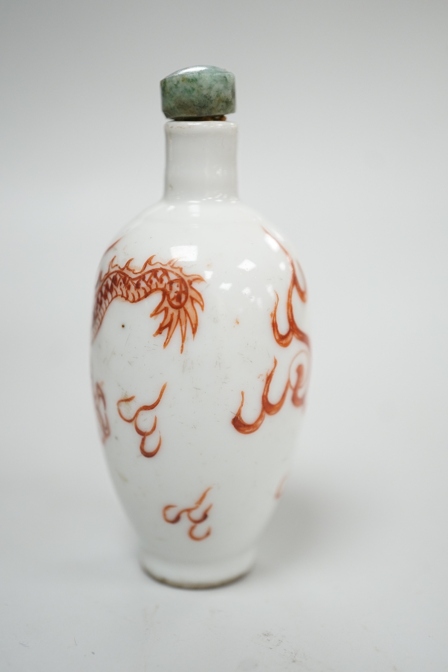 A Chinese rouge-de-fer 'dragon' snuff bottle, late 19th century, 6.7cm